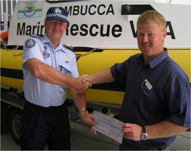 Don Stuart from NSW Water Police presents a cheque on behalf of SOLAS to Owen Rushton from Nambucca Marine Rescue Squad © CYCA . http://www.cyca.com.au